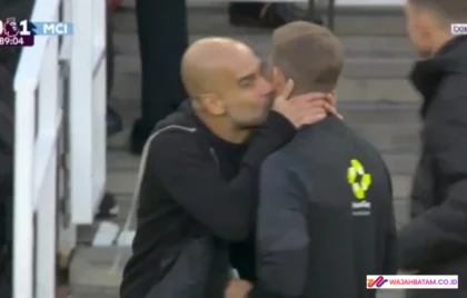 Pep Guardiola kiss official